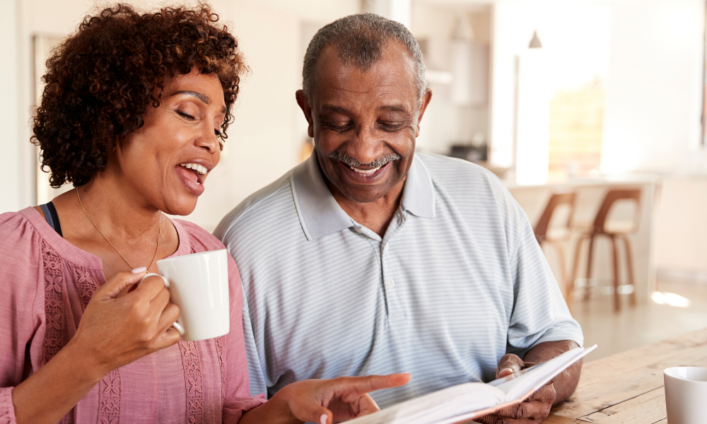 Mature couple reviewing their Medicap papers. In need of Medicare agent in Idaho Falls or Preston, Idaho.