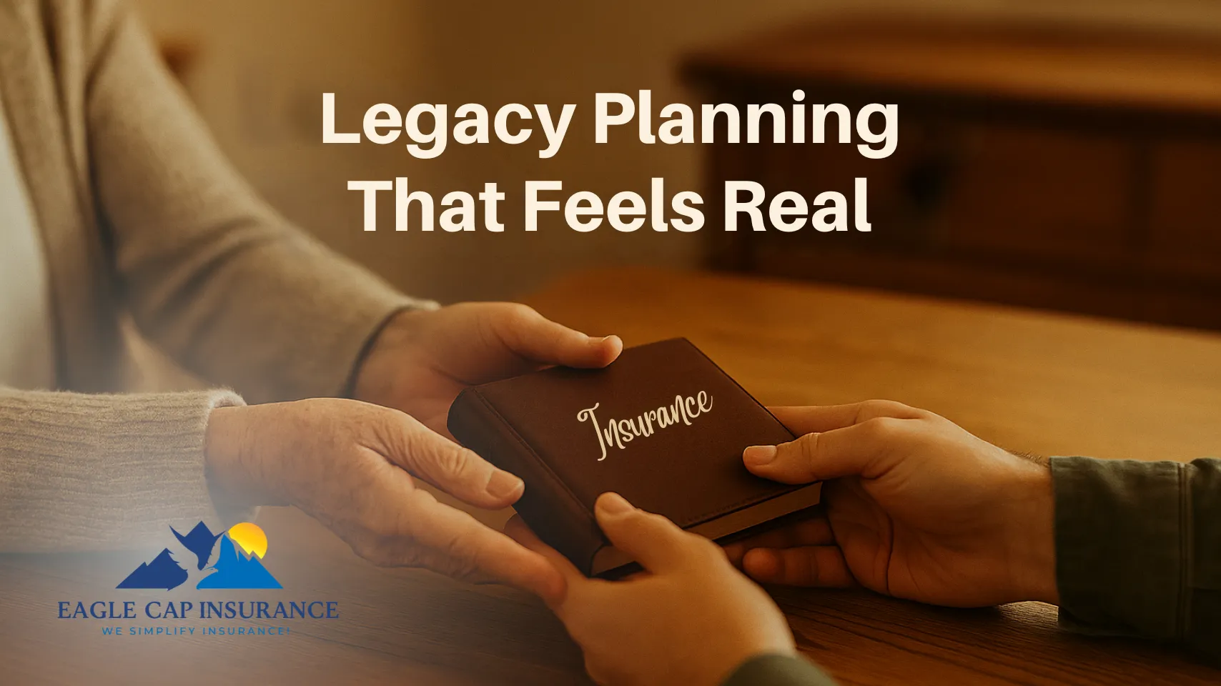 Elderly Idaho parent passing photo album to adult child across wooden table, representing real-life legacy planning through life insurance